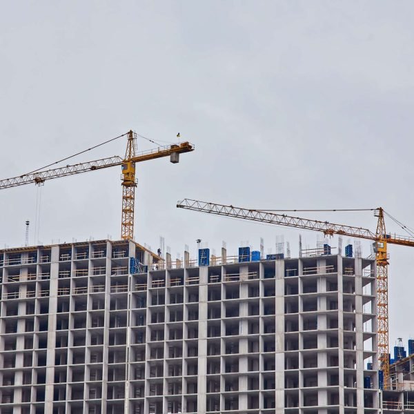 construction-site-with-cranes-min